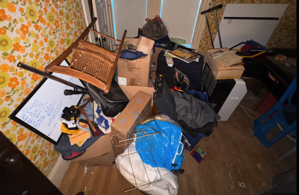 Crew photo of a cluttered room to clear out
